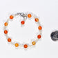 6mm Carnelian Link Bracelet for Women beside a dime.