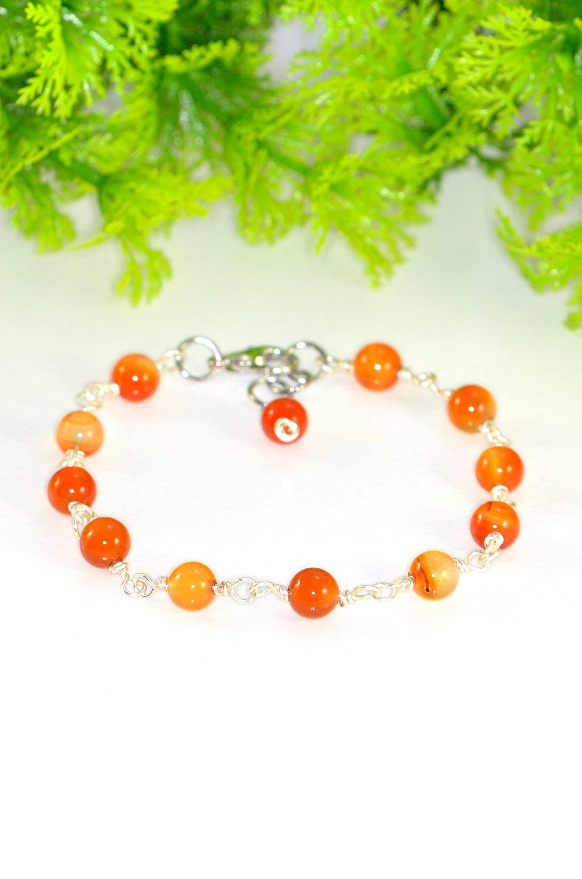 Close up of 6mm Carnelian Link Bracelet for Women.