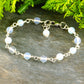 Close up of 6mm Clear White Opal Link Chain anklet.