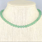 6mm Green Aventurine Crystal Choker Necklace displayed on a bust.
