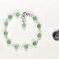 6mm Green Aventurine Link Bracelet beside a dime.