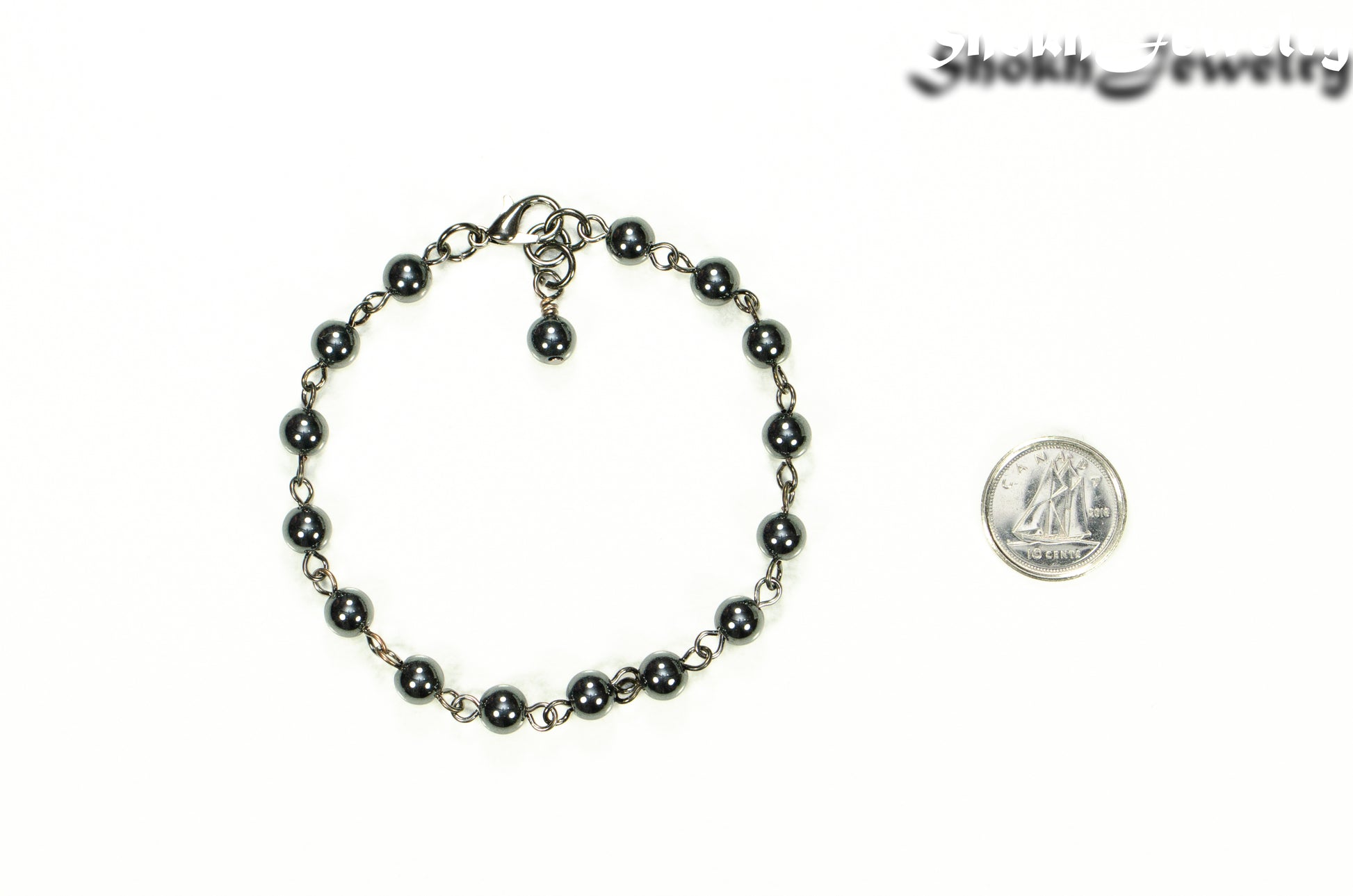 6mm Hematite Link anklet for Women beside a dime.