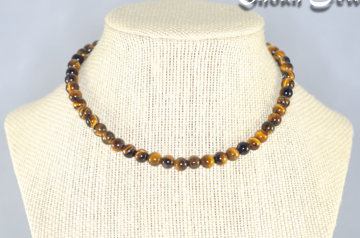6mm Natural Tiger's Eye Choker Necklace displayed on a bust.