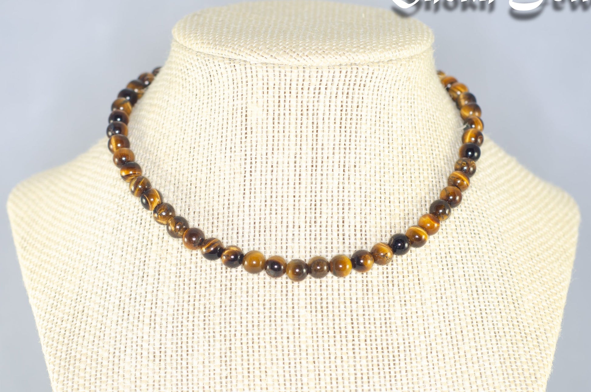 6mm Natural Tiger's Eye Choker Necklace displayed on a bust.
