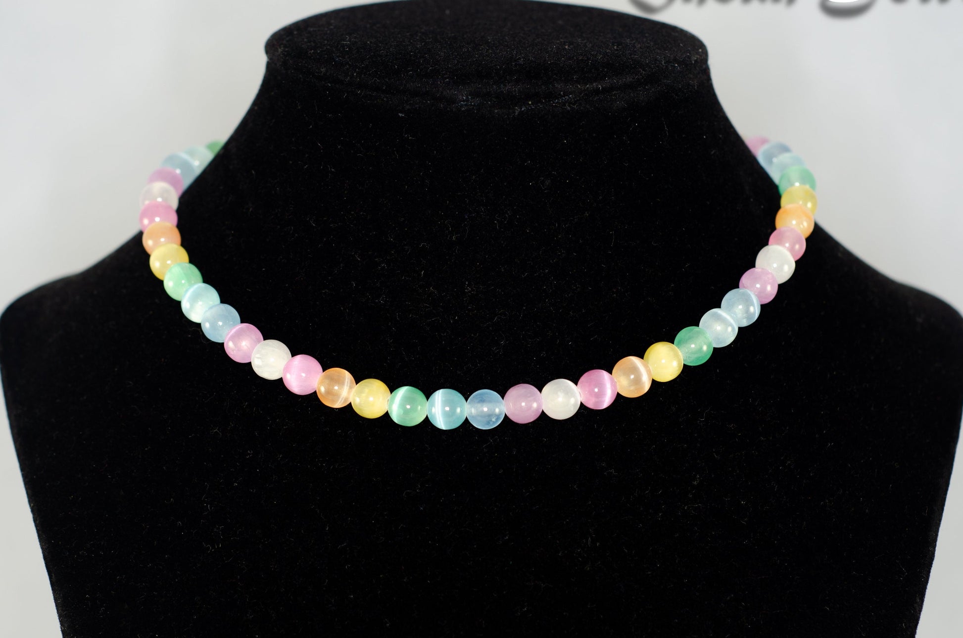 6mm Rainbow Selenite Beaded Choker Necklace displayed on a bust.