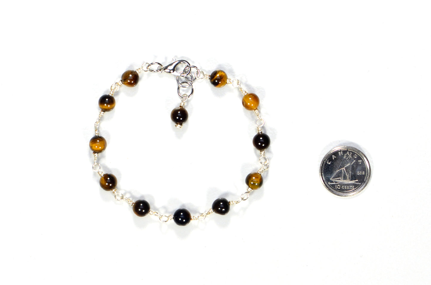 6mm Tiger's Eye Link Chain Bracelet beside a dime.