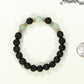 8mm Black Lava Stone and Amazonite Bracelet beside a dime.