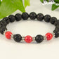 Close up of 8mm Black Lava Stone and Red Howlite Bracelet.