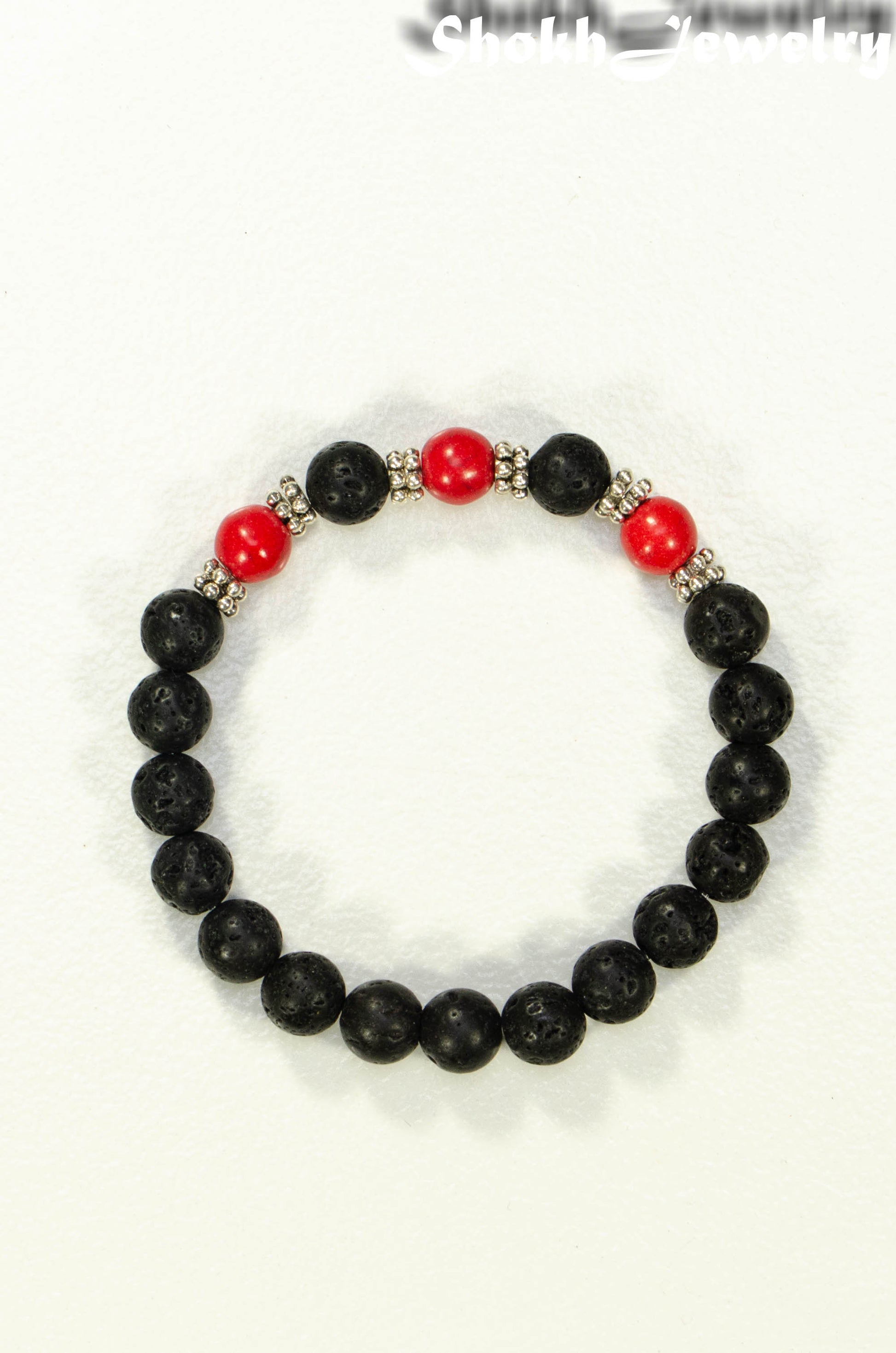 Top view of 8mm Black Lava Stone and Red Howlite Bracelet.