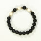 Top view of 8mm Black Lava Stone and White Howlite Bracelet.