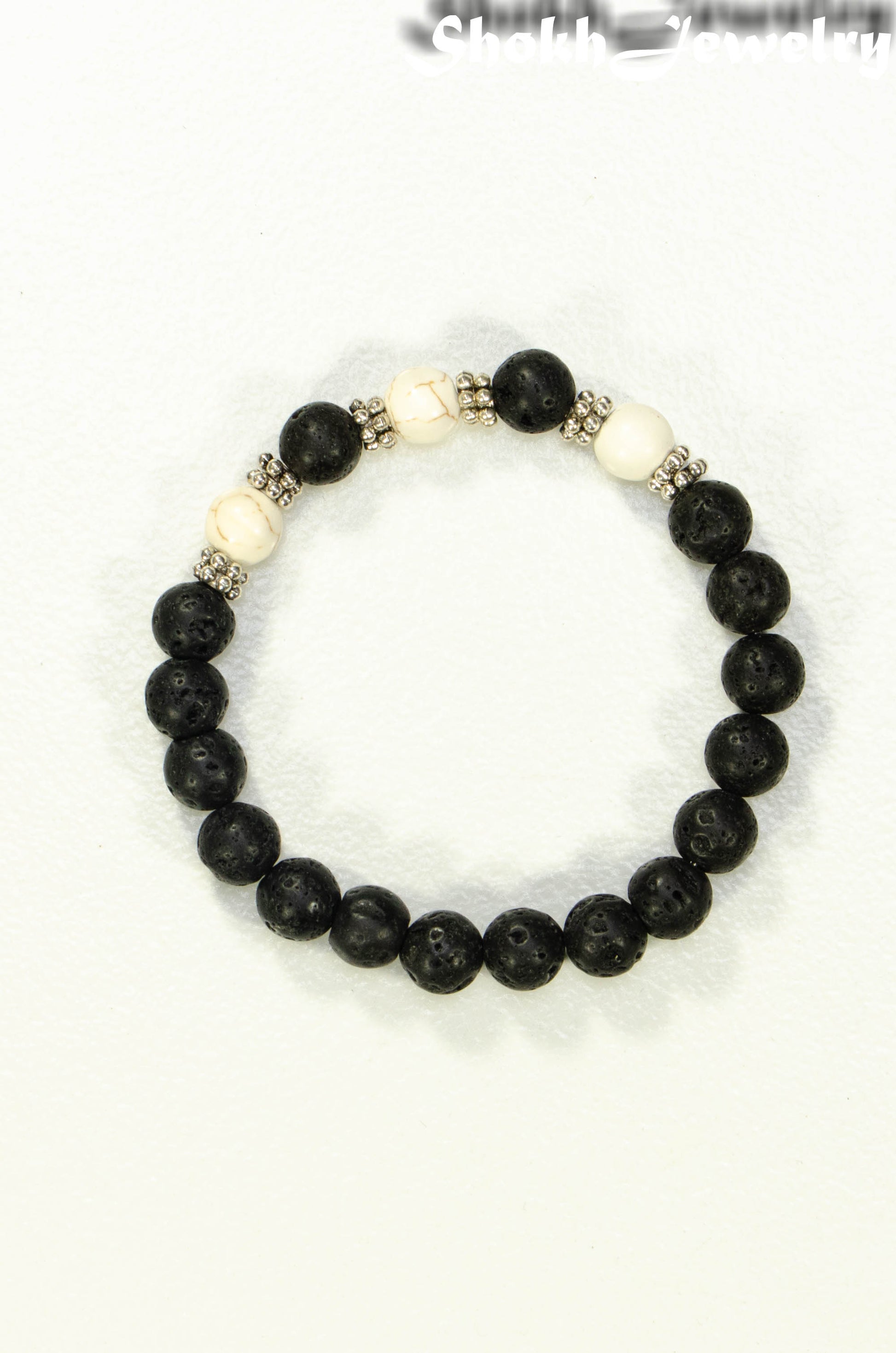 Top view of 8mm Black Lava Stone and White Howlite Bracelet.