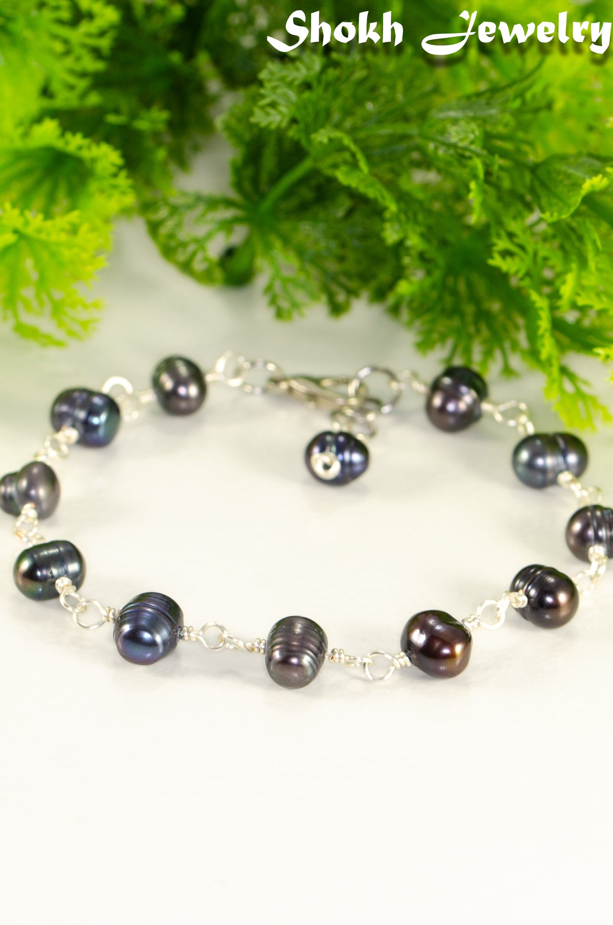Close up of Black Dyed Freshwater Pearls Link Chain Anklet.