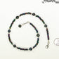 Black Freshwater Pearl and Seed Bead Choker Necklace beside a dime.