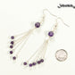 Cascading Amethyst Crystal Drop Earrings beside a dime.