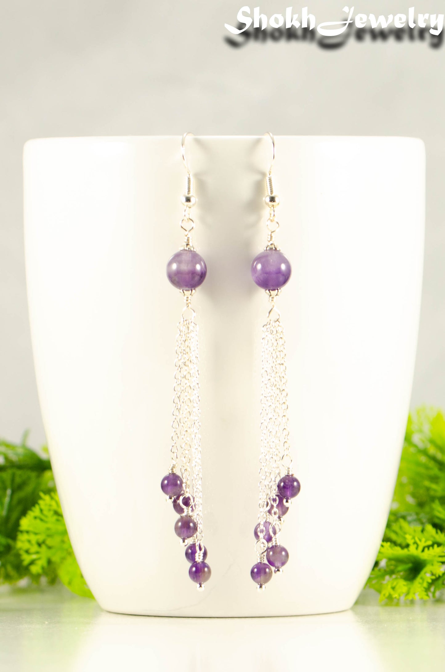 Close up of Cascading Amethyst Crystal Drop Earrings.