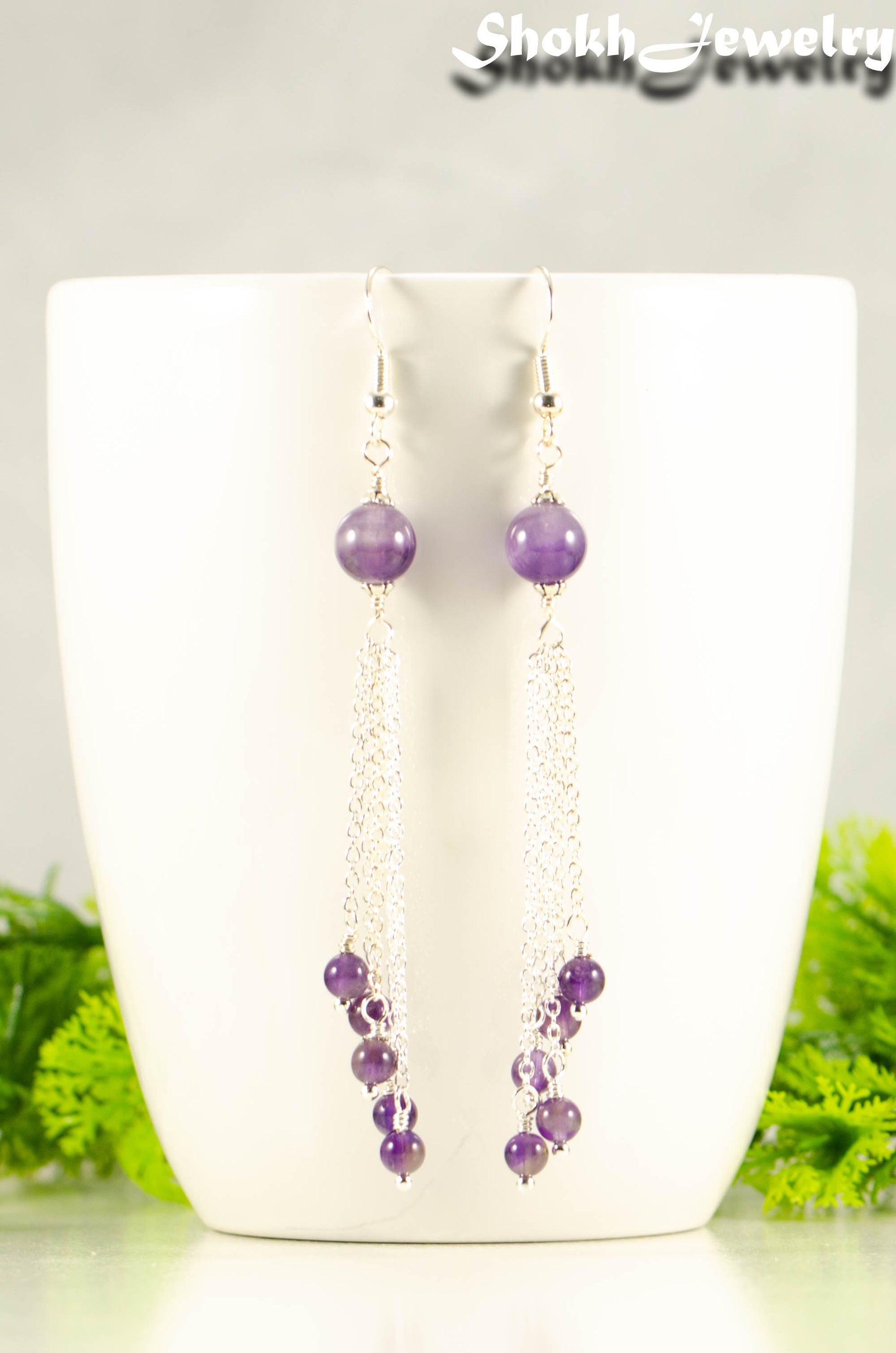 Close up of Cascading Amethyst Crystal Drop Earrings.