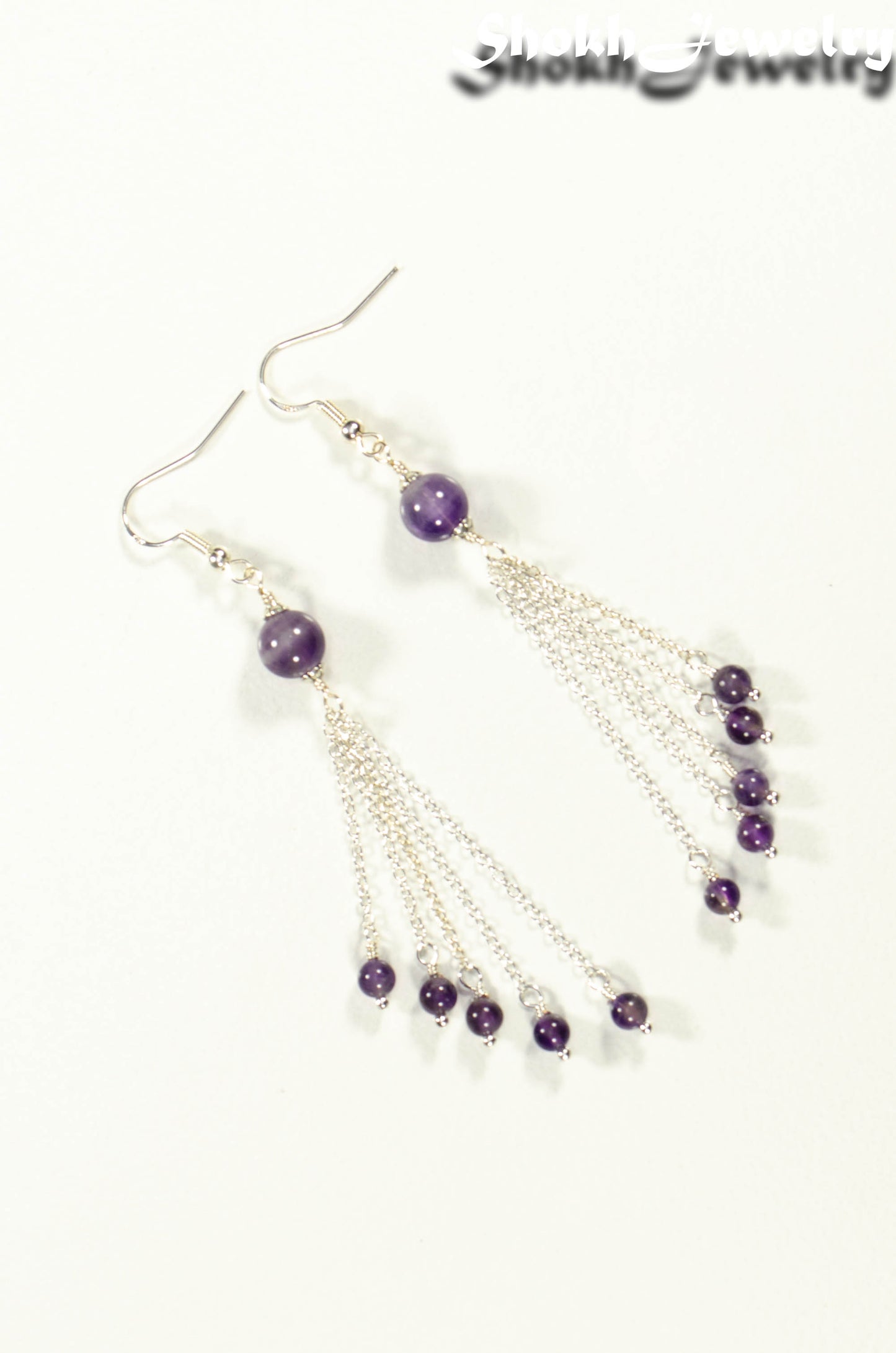 Top view of Cascading Amethyst Crystal Drop Earrings.