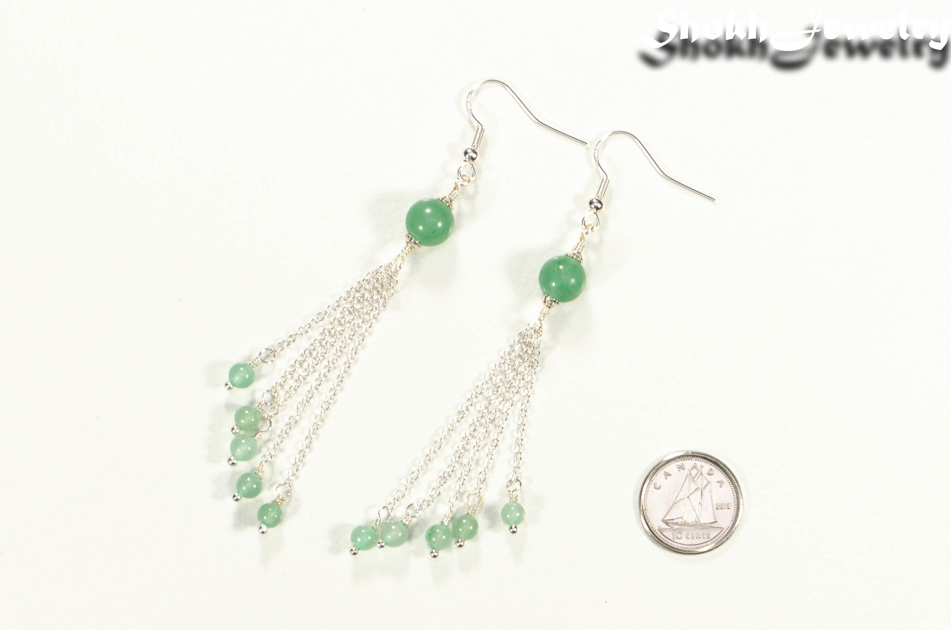 Cascading Green Aventurine Crystal Drop Earrings beside a dime.