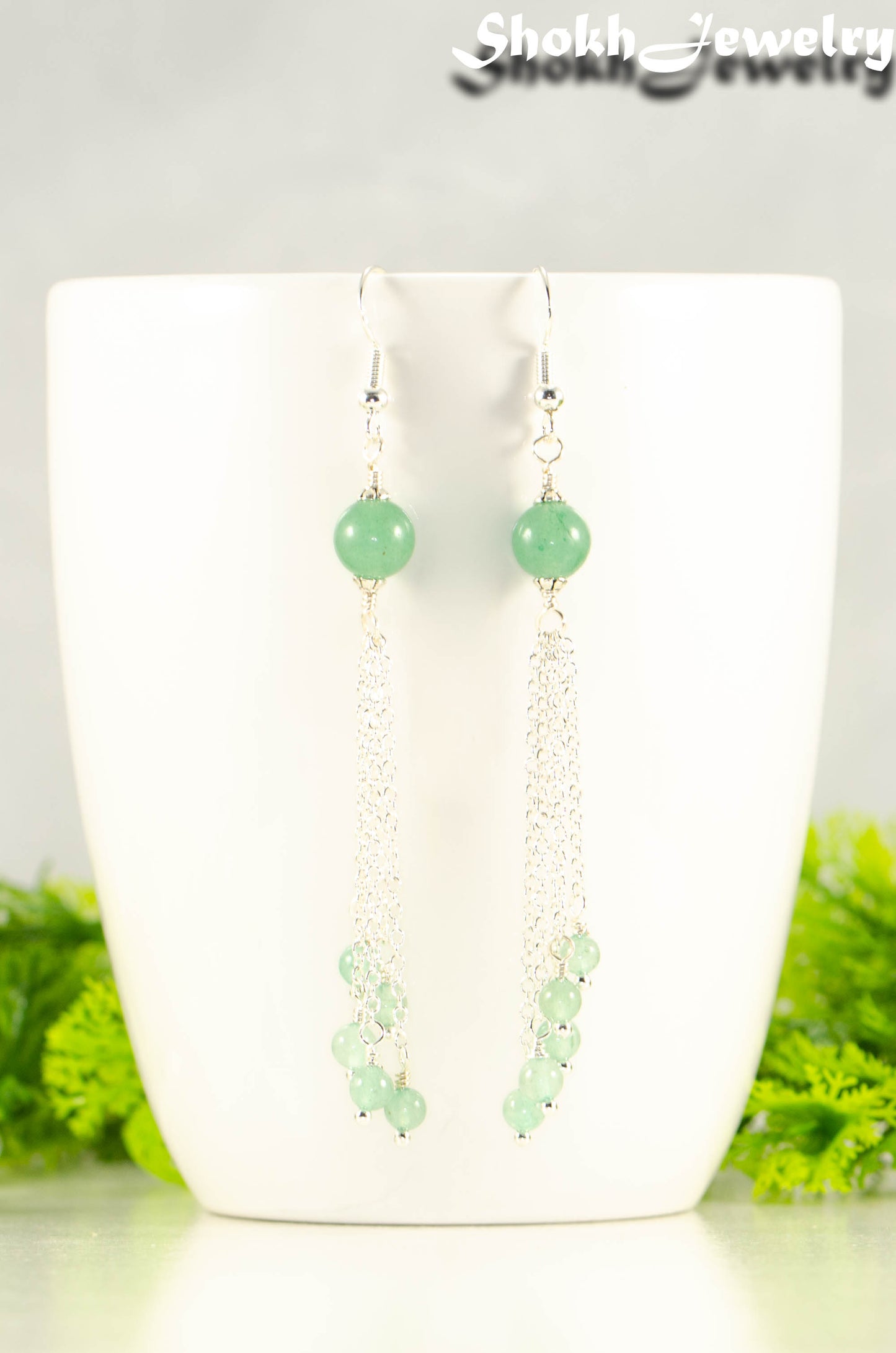 Close up of Cascading Green Aventurine Crystal Drop Earrings.