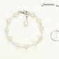 Handmade Freshwater Pearls Link Chain Bracelet on white background.