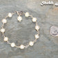 Handmade Freshwater Pearls Link Chain Bracelet beside a dime.