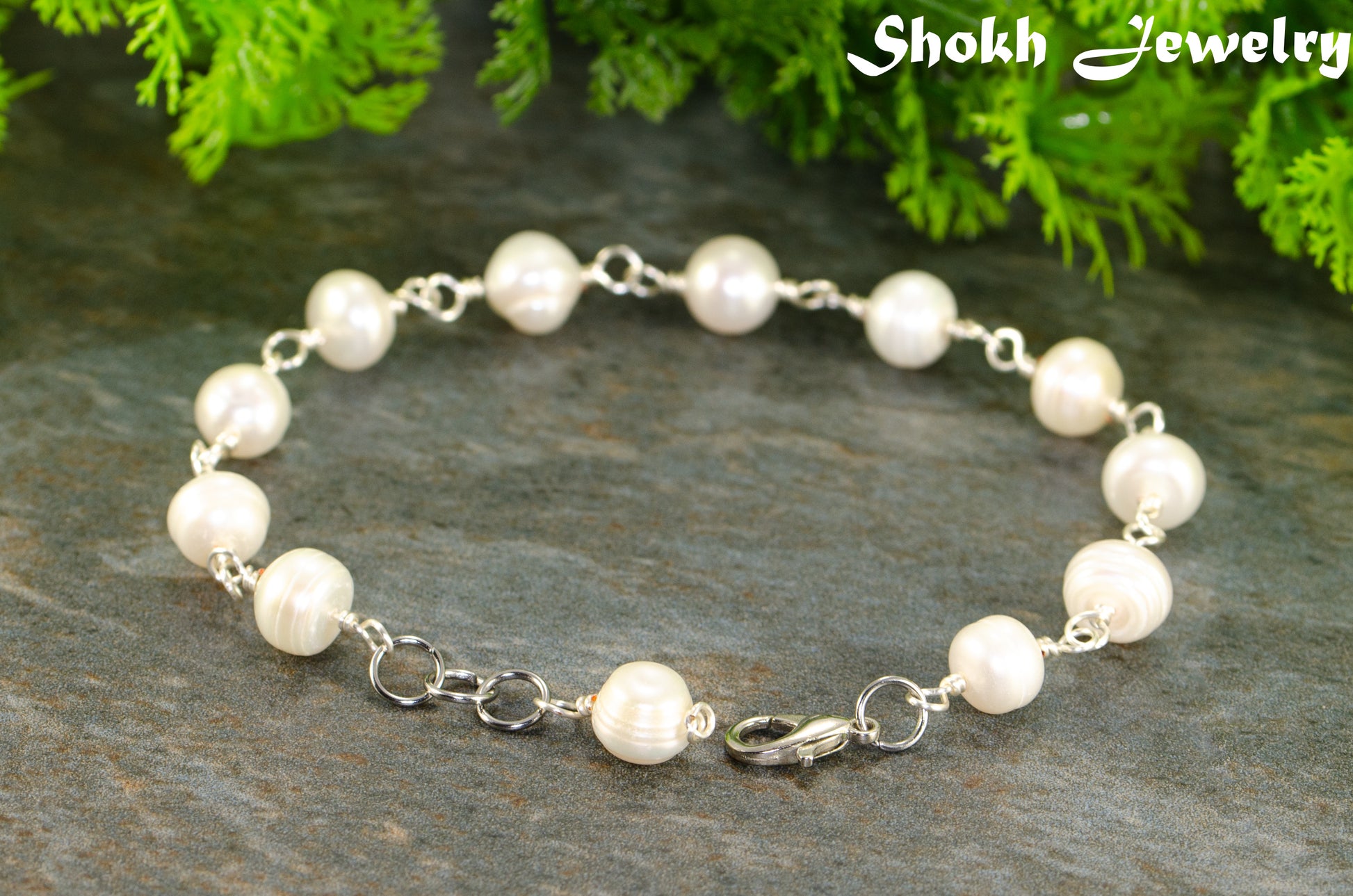 Close up of Handmade Freshwater Pearls Link Chain Bracelet.