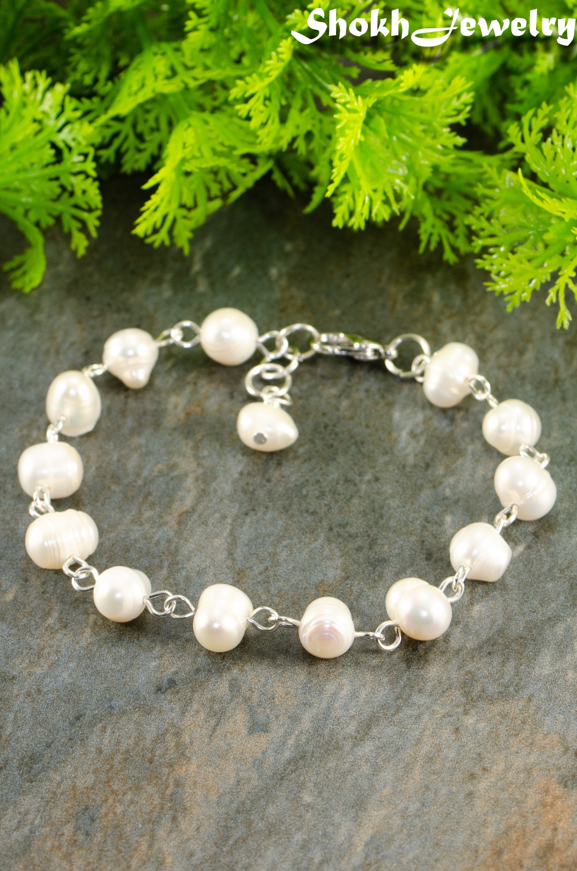 Close up of Handmade Freshwater Pearls Link Chain Bracelet.