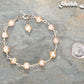 Lavender Freshwater Pearls Link Chain Bracelet beside a dime.