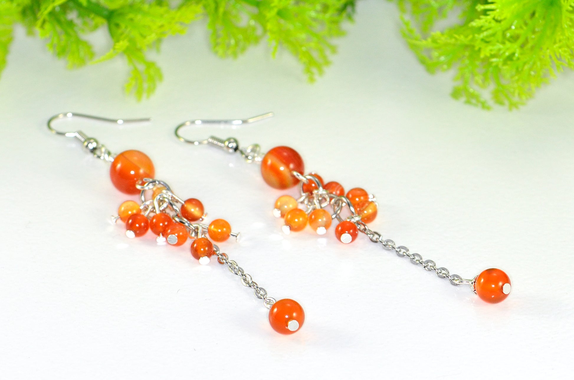 Close up of Long Stainless Steel Chain and Carnelian Earrings.