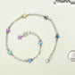 Rainbow Hematite Star and Chain Choker Necklace beside a dime.