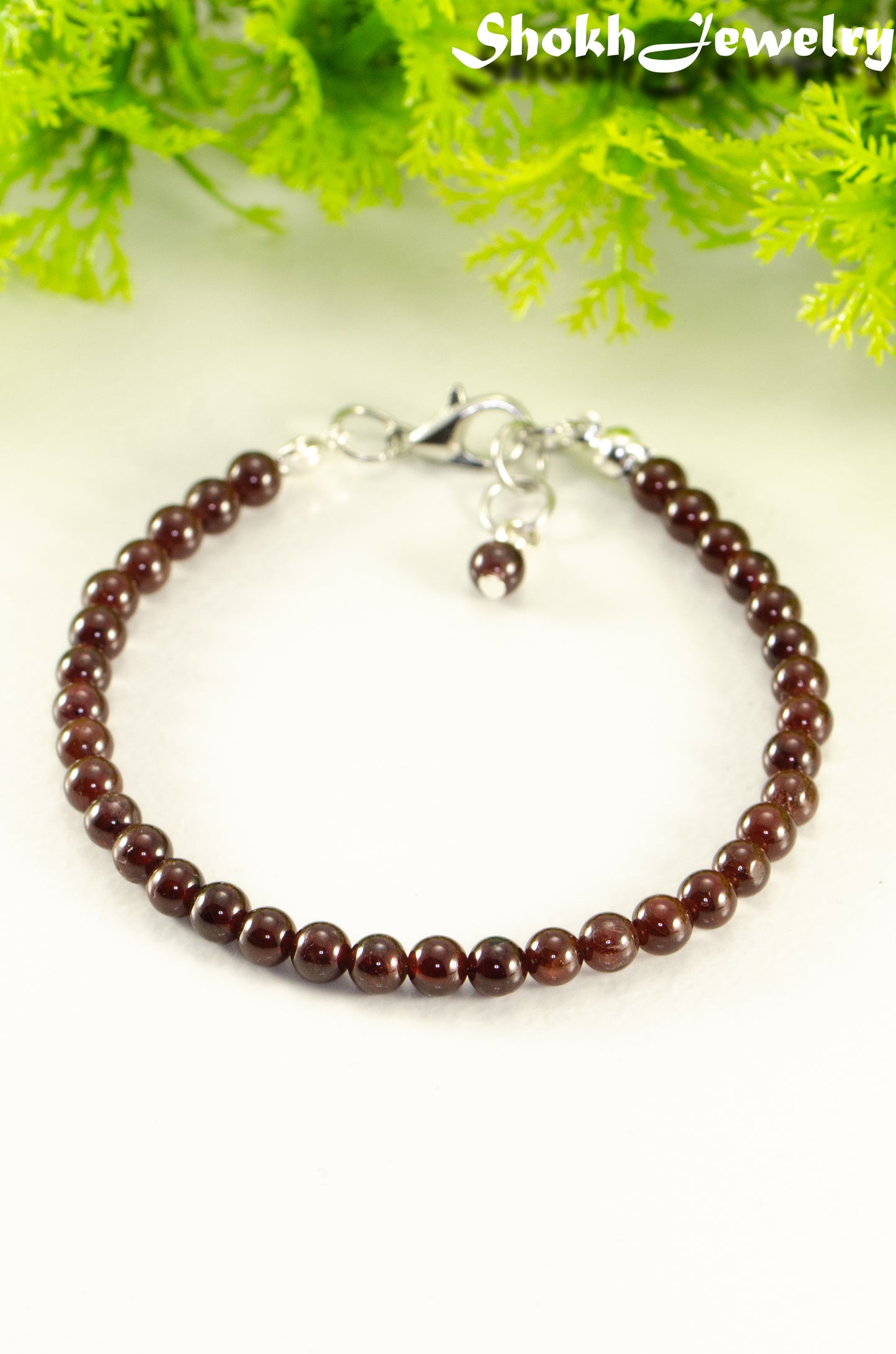 Close up of Dainty Garnet Bracelet with Clasp.