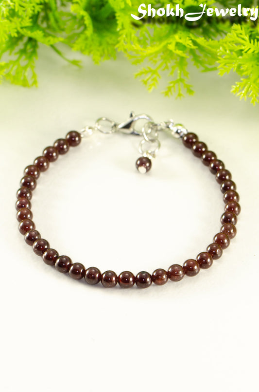 Close up of Dainty Garnet anklet with Clasp.