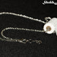 Miniature Toilet Paper Roll and Dainty Chain Choker Necklace with lobster claw clasp closure.