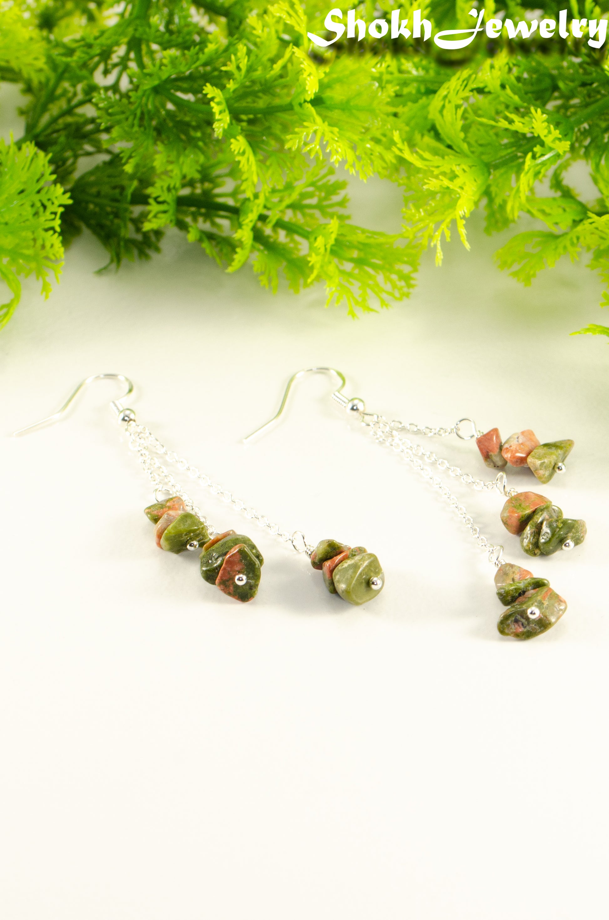Close up of Long Silver Plated Chain and Unakite Crystal Chip Earrings.