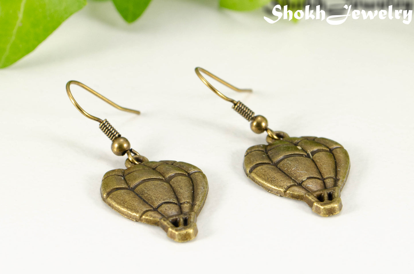 Close up of Antique Bronze Hot Air Balloon Charm Earrings.