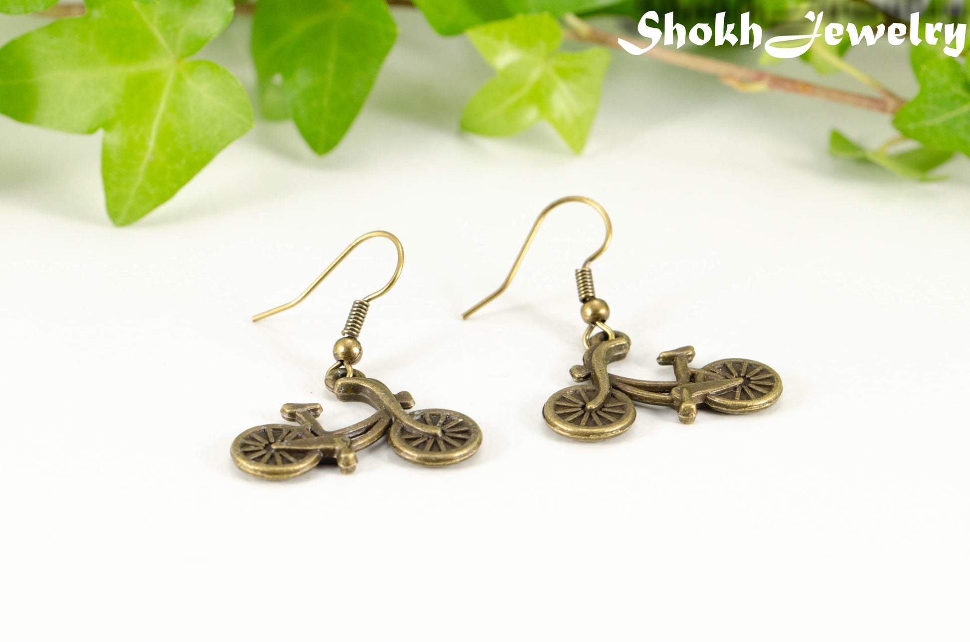 Antique Bronze Bicycle Charm Earrings for women.