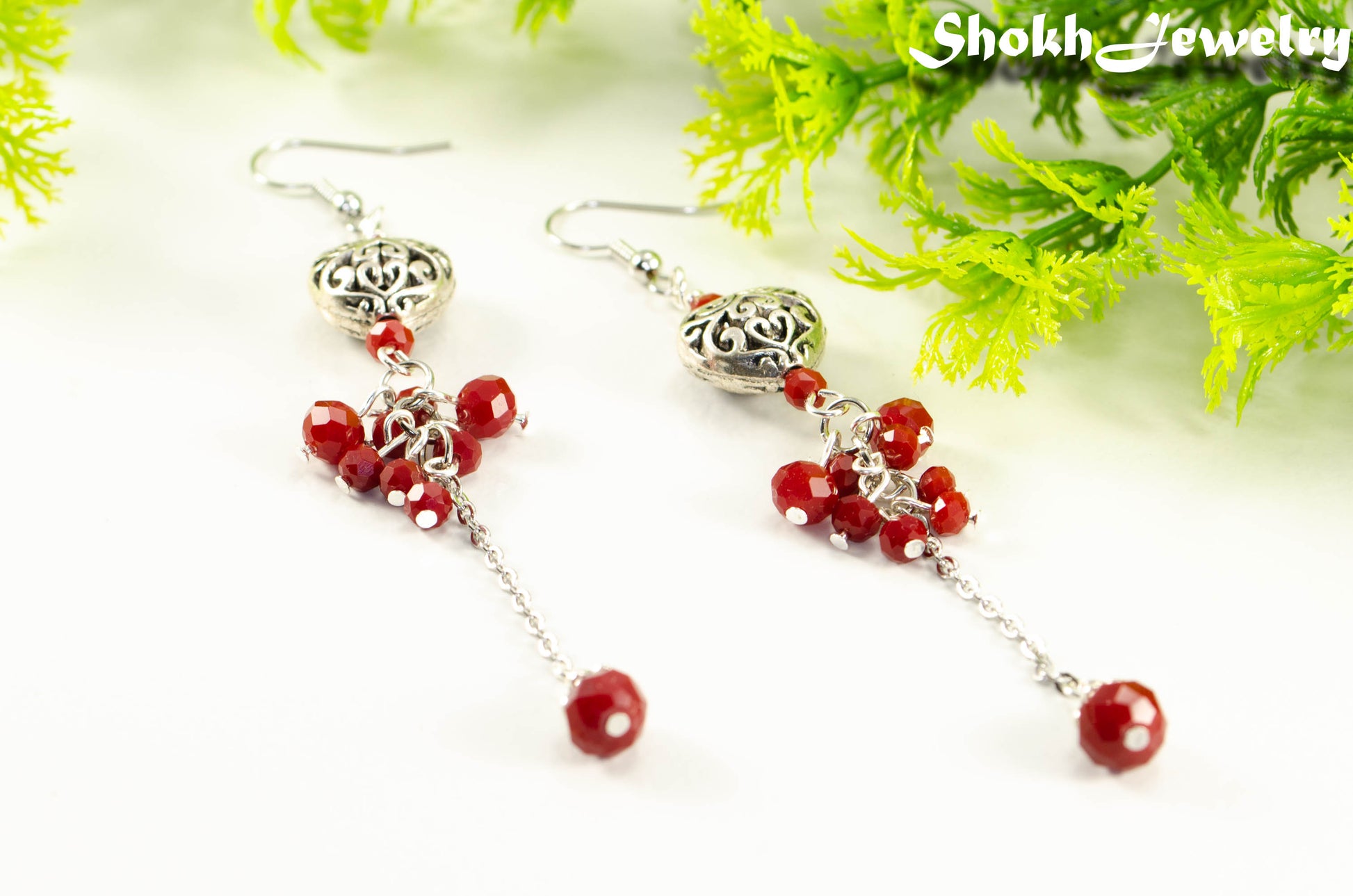 Close up of Statement Tibetan Silver Heart and Red Beaded Cluster Earrings.