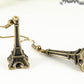 Close up of Antique Bronze 3D Eiffel Tower Charm Earrings.