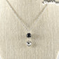 Lava Rock and Heart Shaped April Birthstone Choker Necklace displayed on a dime.