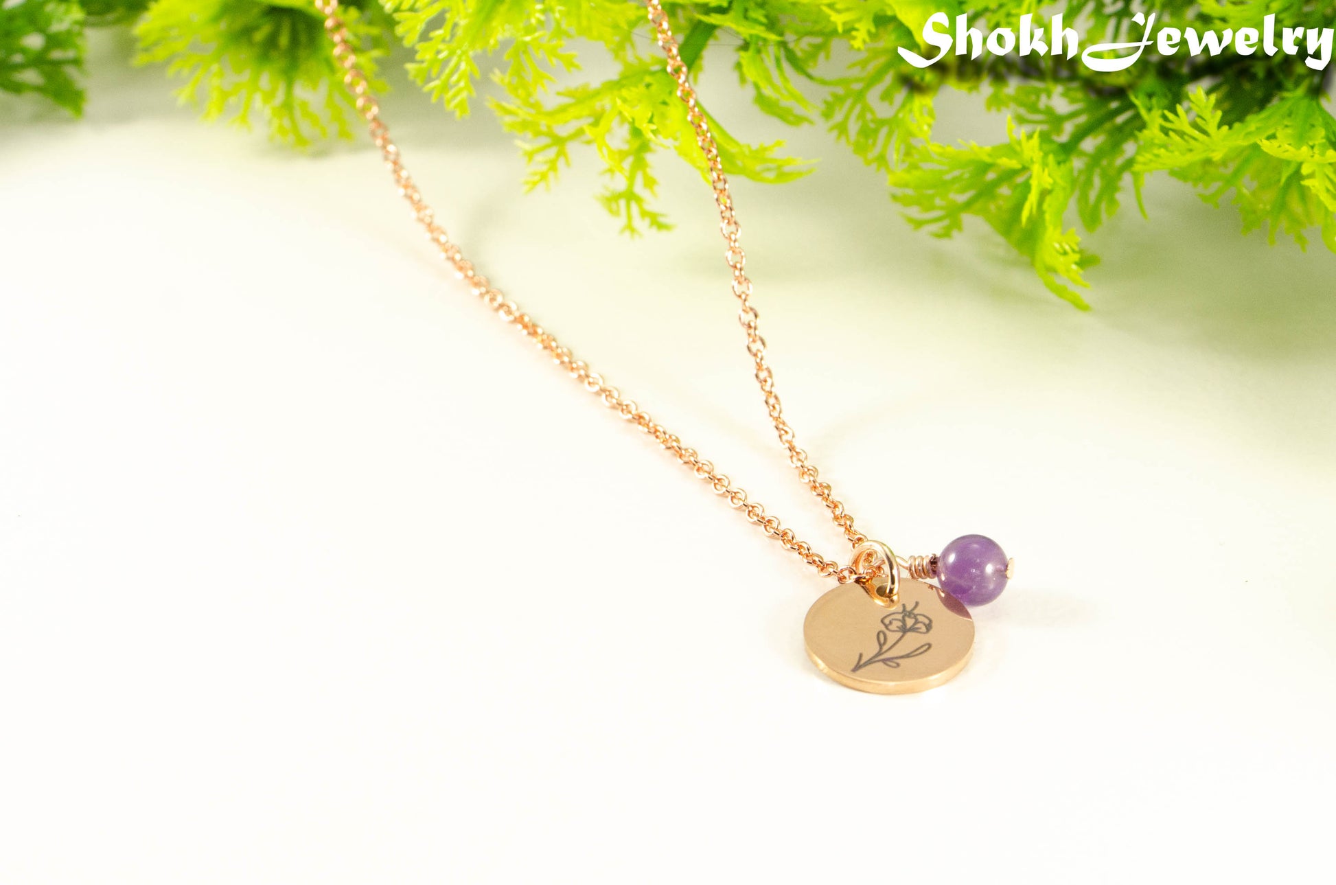 Close up of Rose Gold Plated February Birth Flower Necklace with Amethyst Birthstone Pendant.