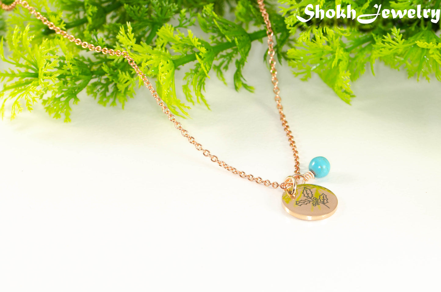 Close up of Rose Gold Plated December Birth Flower Necklace with Turquoise Howlite Birthstone Pendant.