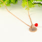 Close up of Rose Gold Plated July Birth Flower Necklace with Red Ruby Birthstone Pendant.