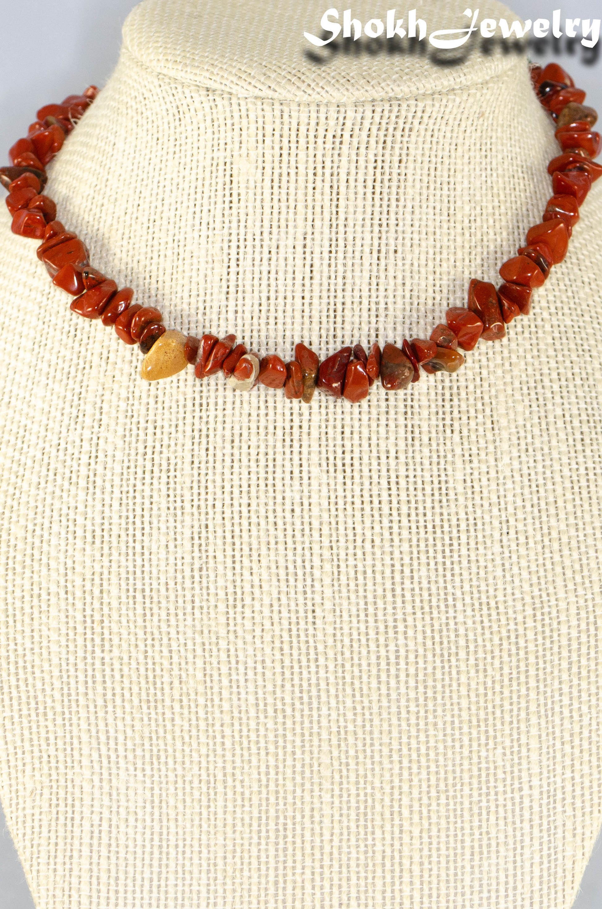 Natural Red Jasper Crystal Chip Choker Necklace displayed on a bust.