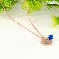 Close up of Rose Gold Plated September Birth Flower Necklace with Sapphire Birthstone Pendant.