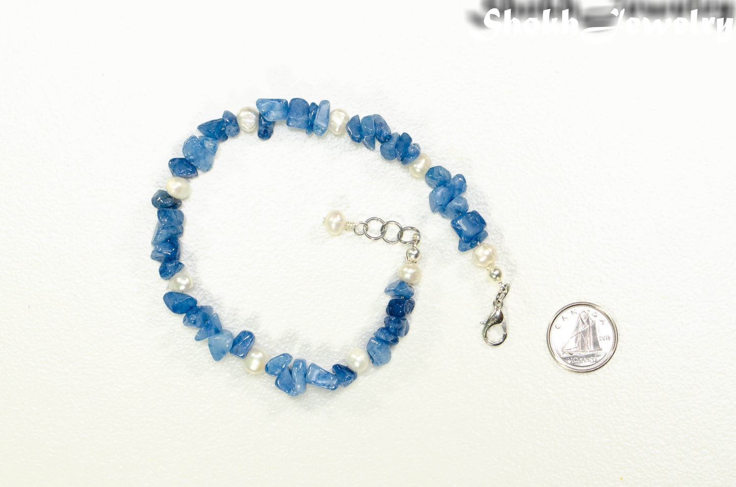 Natural Blue Quartzite Crystal Chip and Pearls Bracelet beside a dime.