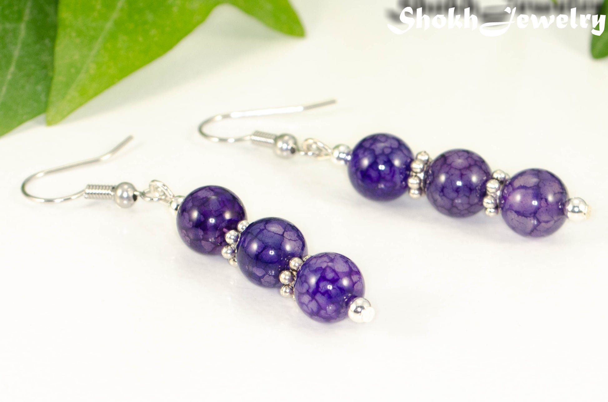 Close up of Natural Purple Dragon Vein Agate Beaded Bar Earrings.