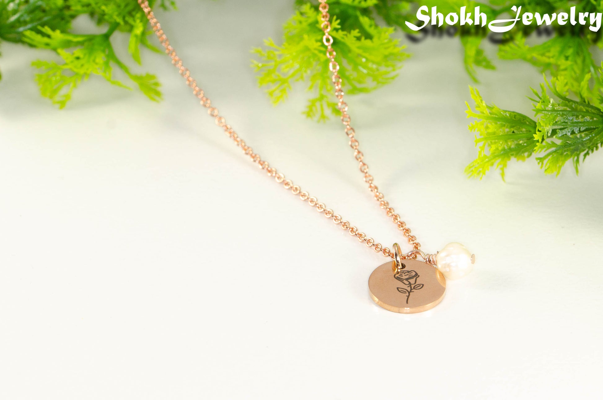 Close up of Rose Gold Plated June Birth Flower Necklace with Freshwater Pearl Pendant.