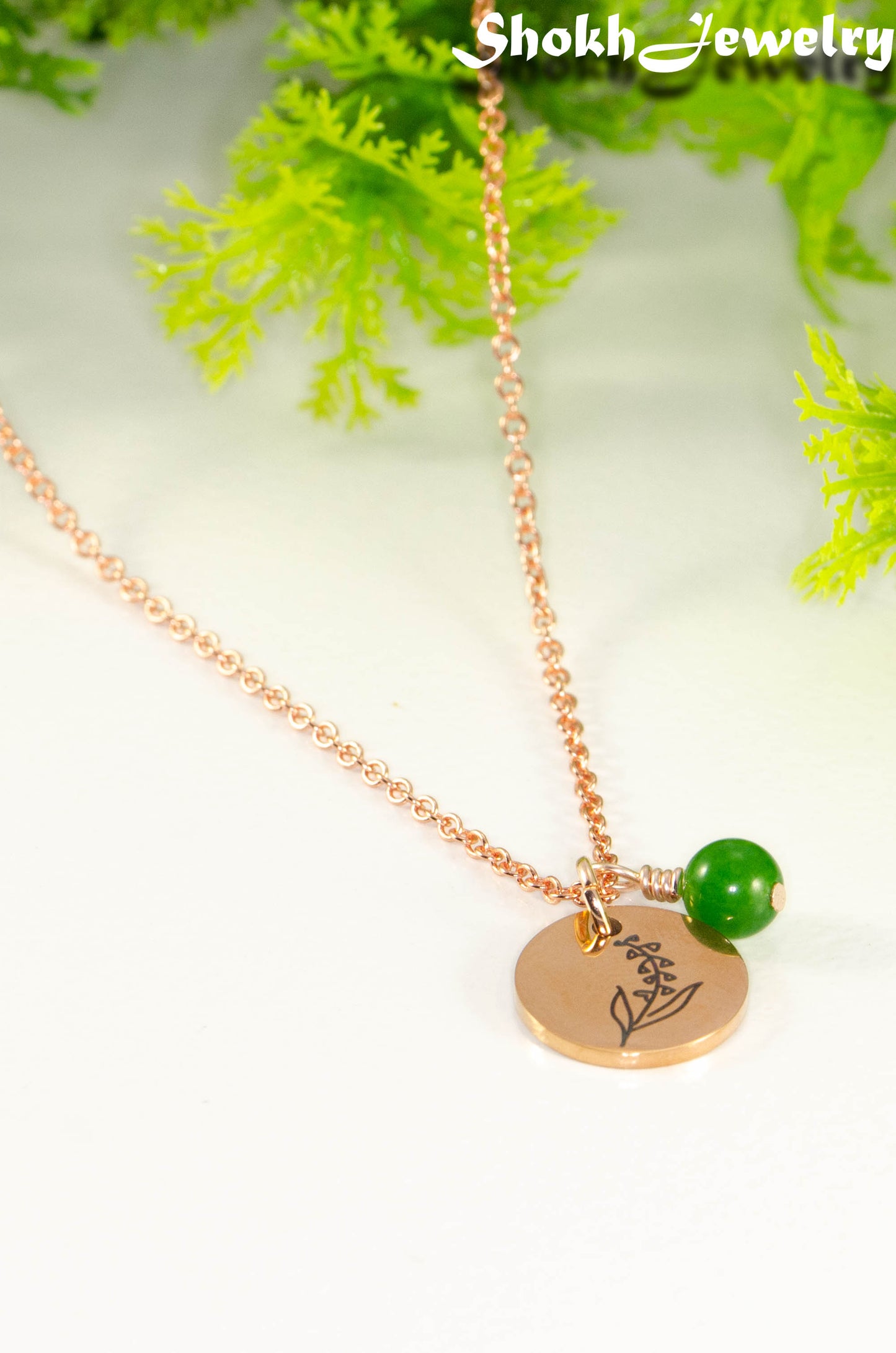 Rose Gold Plated May Birth Flower Necklace with Emerald Birthstone Pendant.