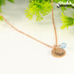 Close up of Rose Gold Plated March Birth Flower Necklace with Aquamarine Birthstone Pendant.