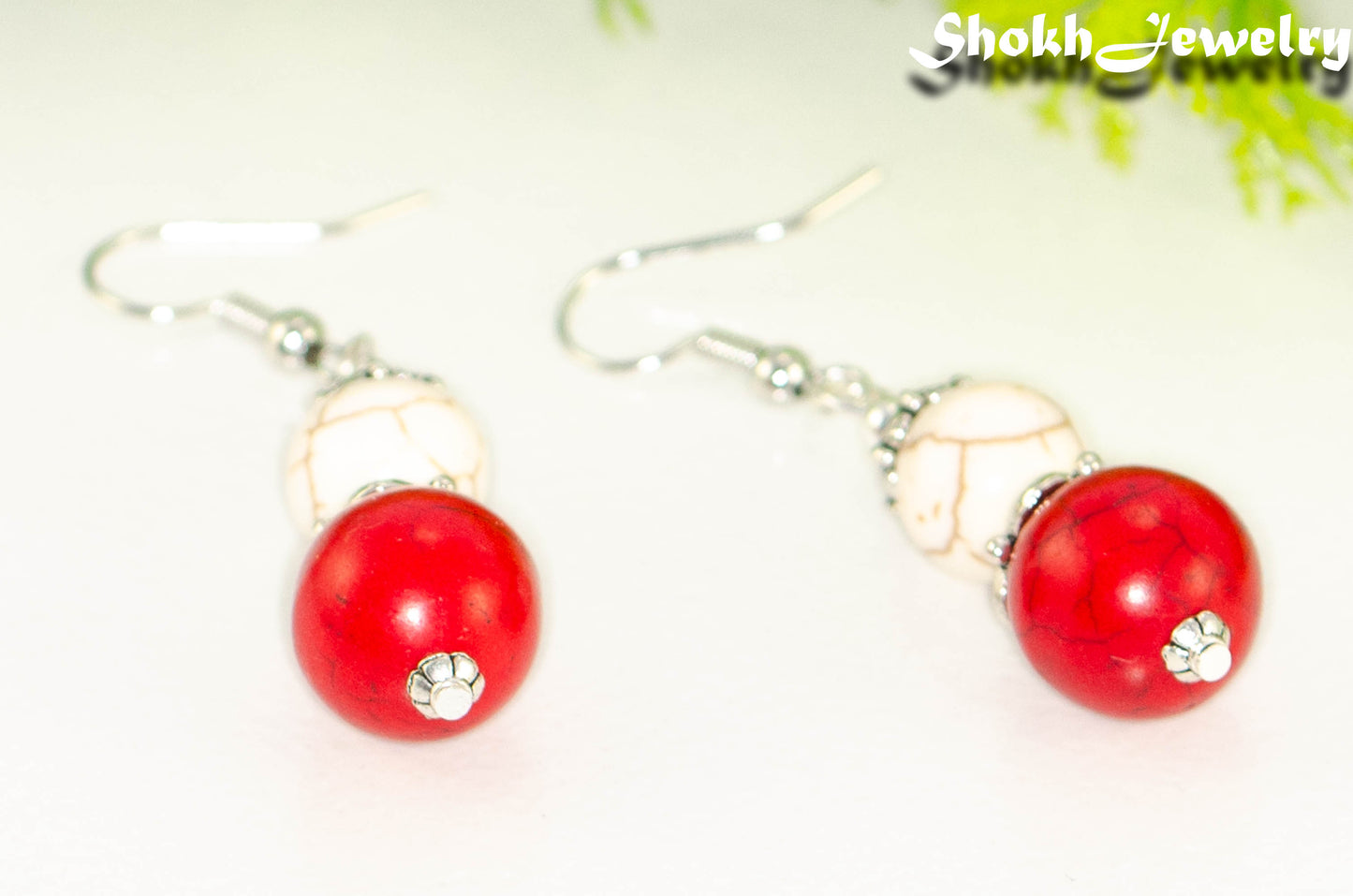 Close up of Red and White Howlite Dangle Earrings.